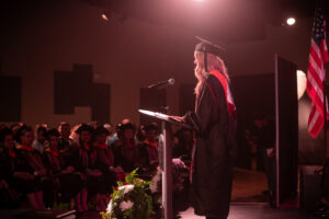 female graduate at podium