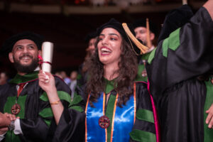 female graduate celebrating
