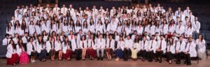 CHSU College of Osteopathic Medicine Class of 2030 students pose together in their white coats following the White Coat Ceremony.