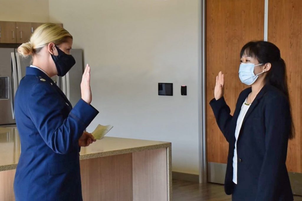 Dr. Jackson giving Michelle Tan the Oath.