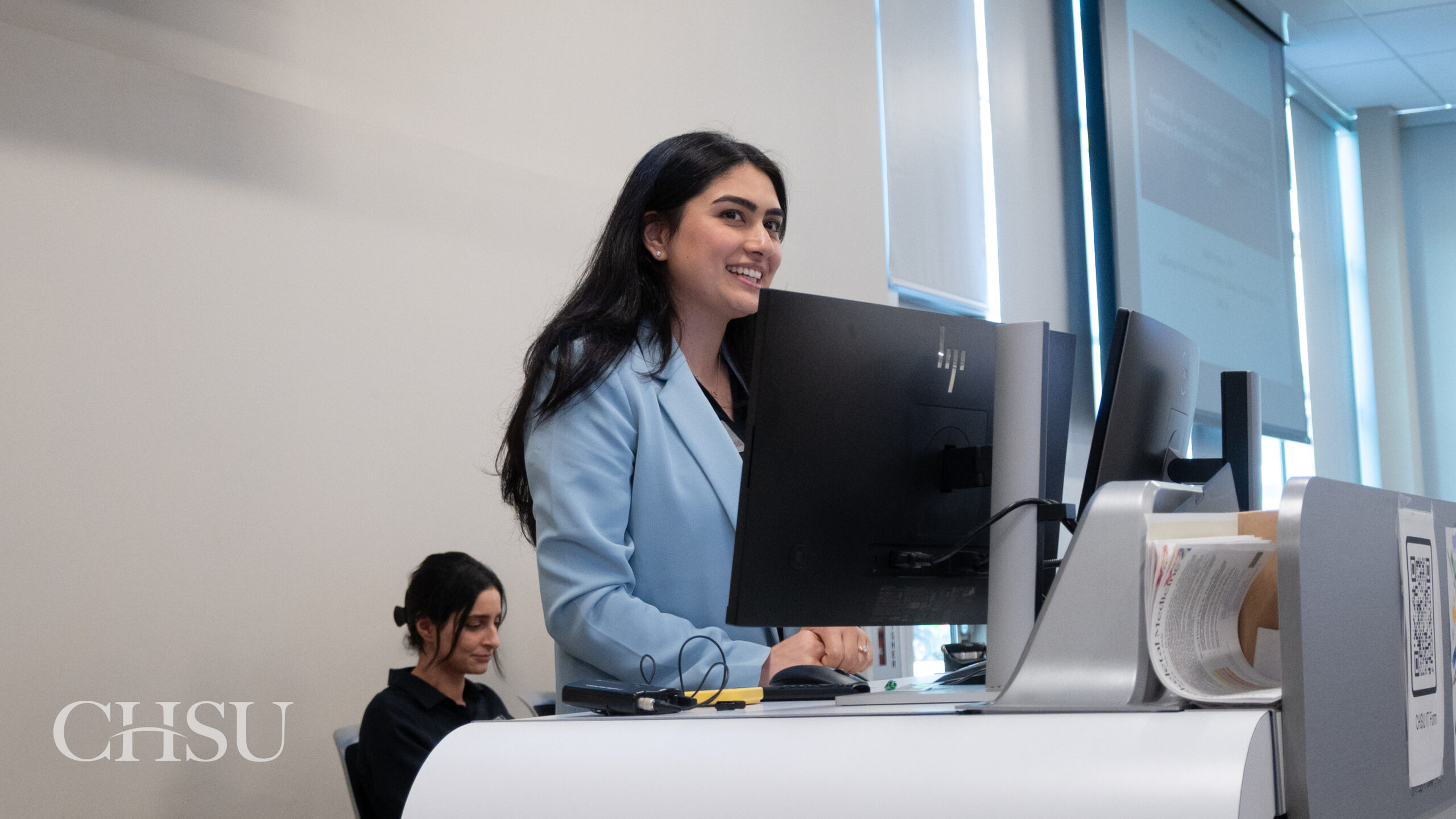 presenter at podium at CHSU Research Day