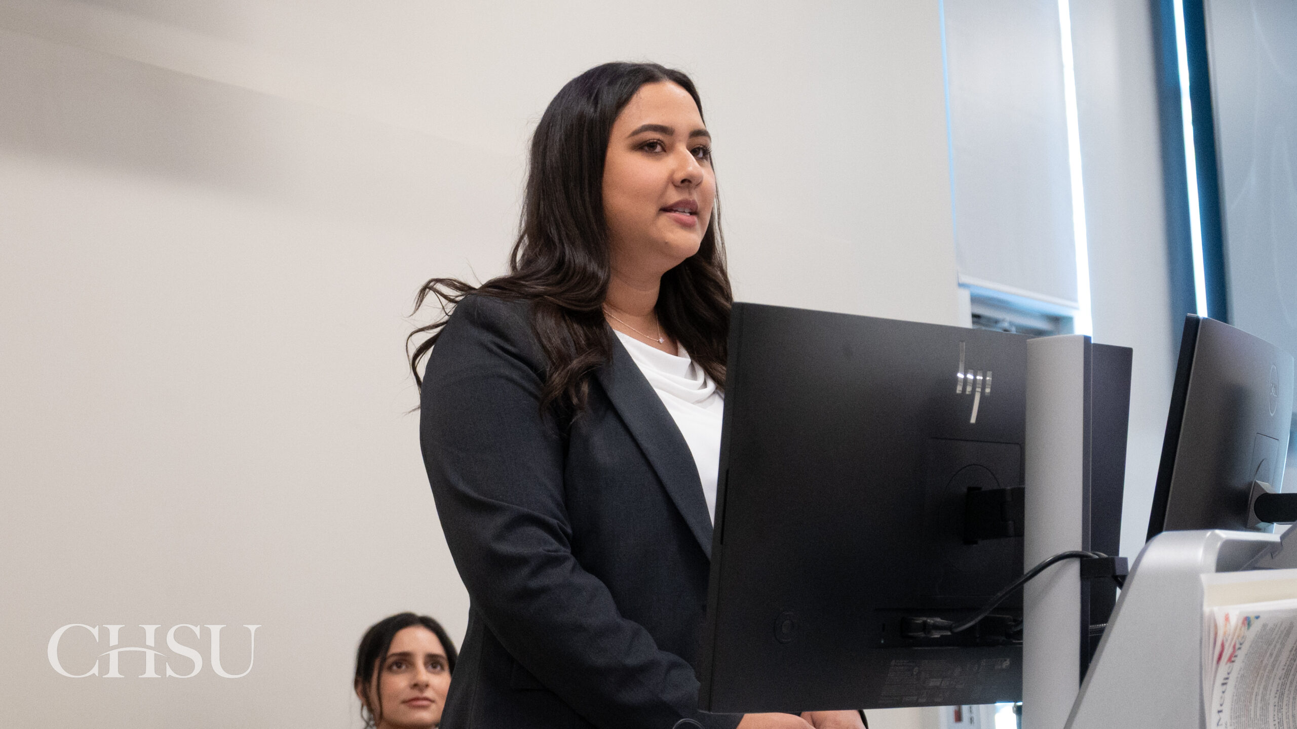 presenter at podium at CHSU Research Day