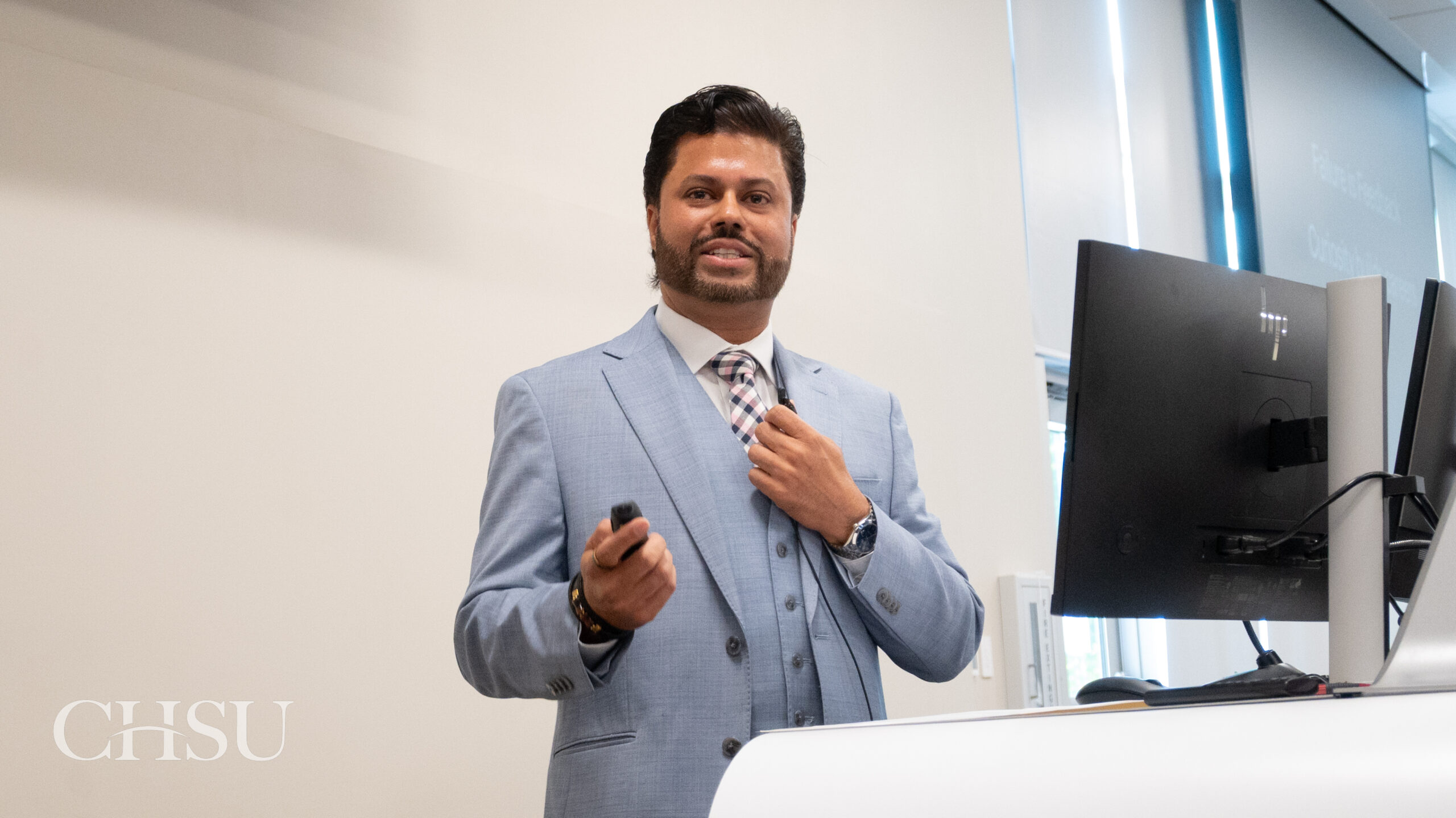Dr. Brar speaking at podium at CHSU Research Day