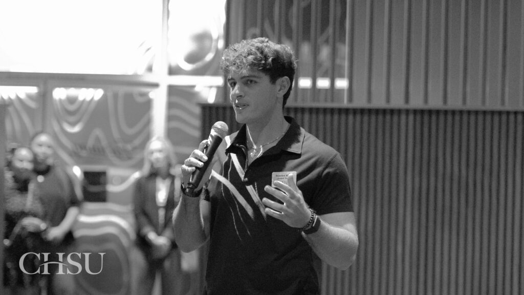 Image of a CHSU student giving a speech at the Sip and Swing Golf fundraiser.