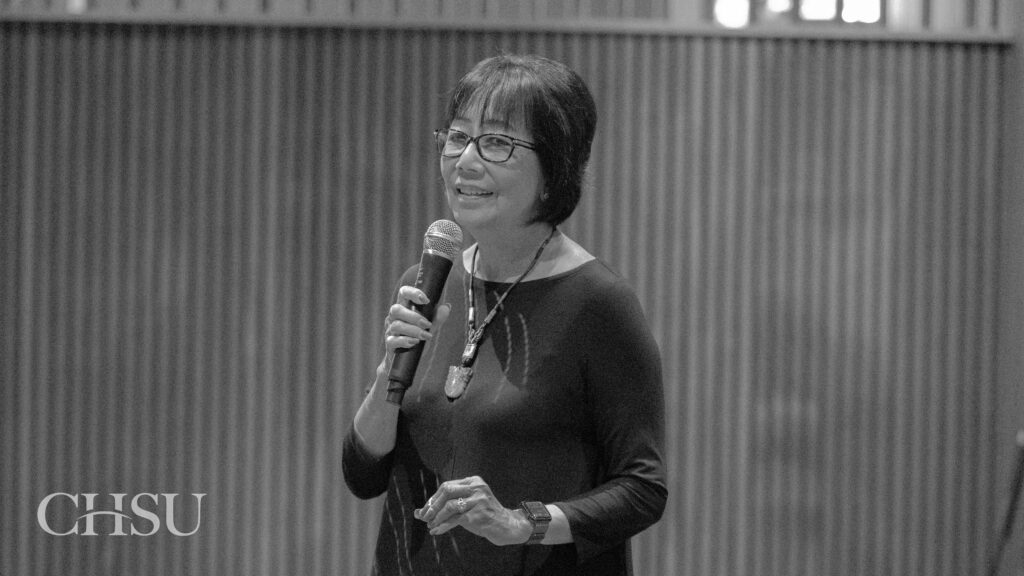 President Flo giving a speech at the CHSU Sip and Swing fundraiser