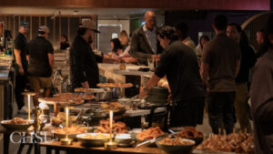 a group of people eating appetizers at the CHSU Sip and Swing Event