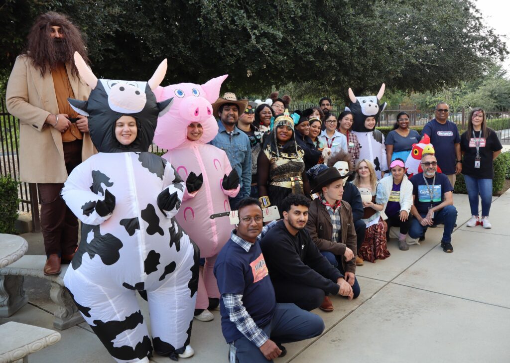 group photo faculty and students wearing Halloween costumes