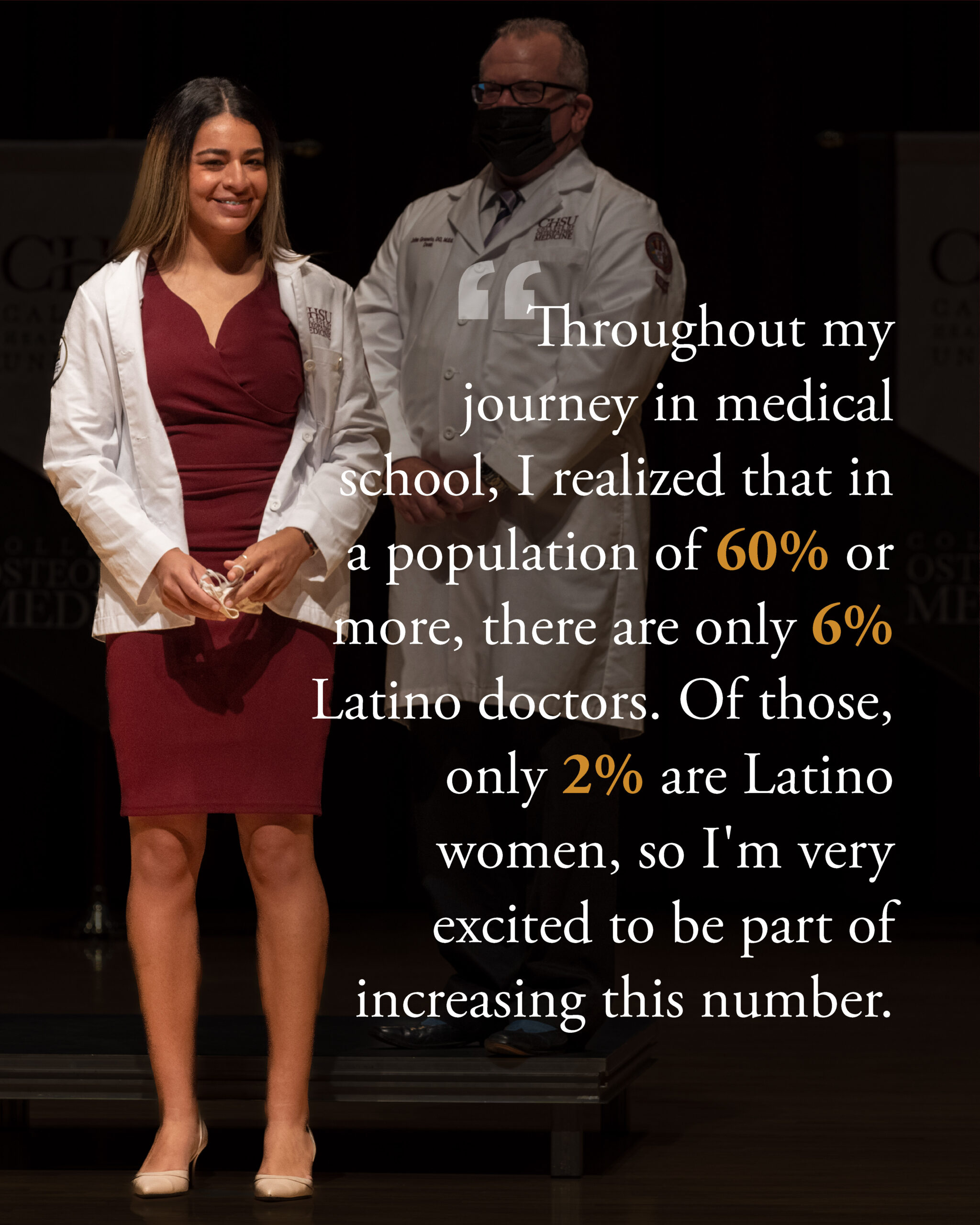 female student wearing white coat with faculty in white coat in background