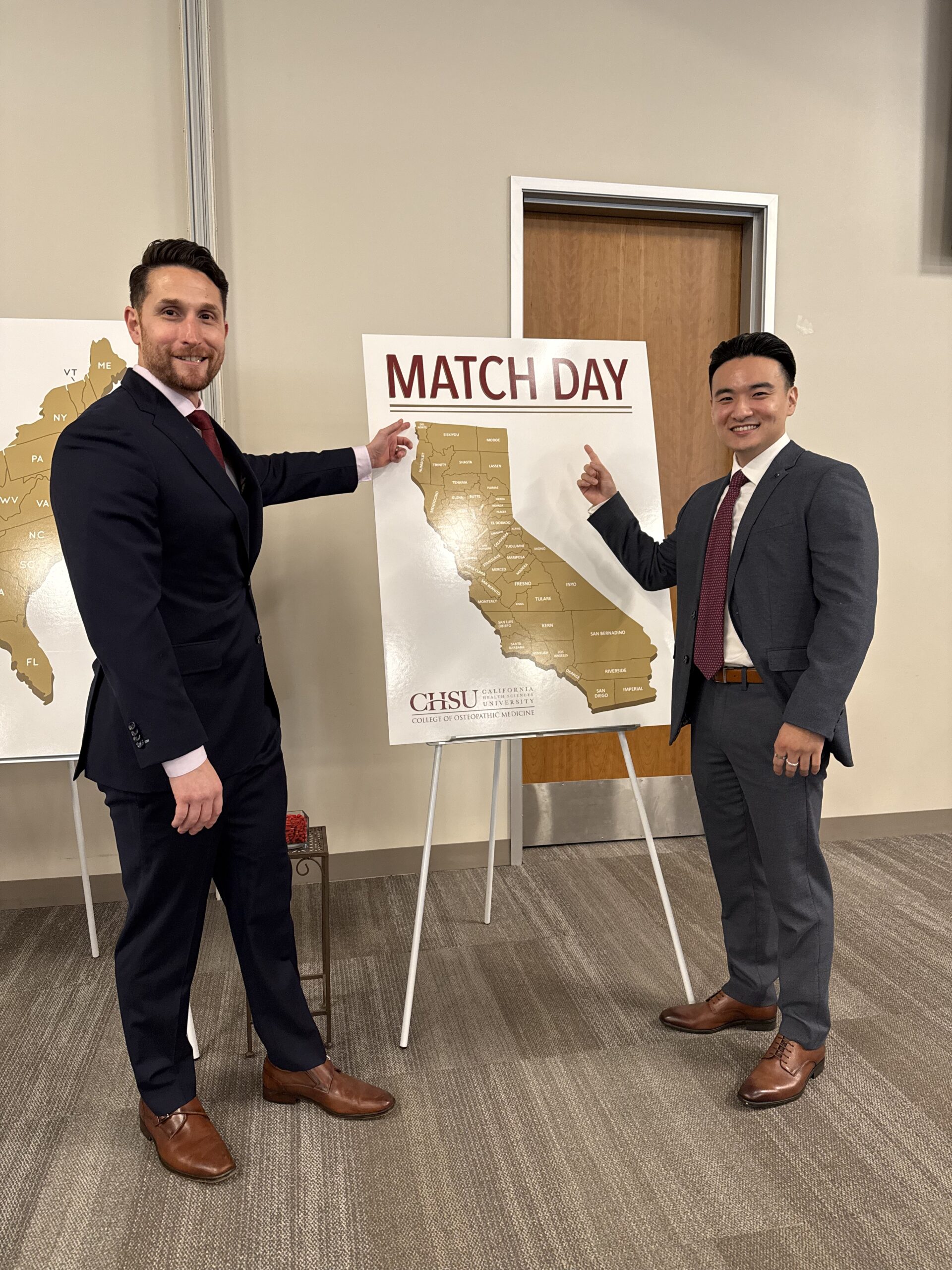 faculty and student pointing to CA match day map