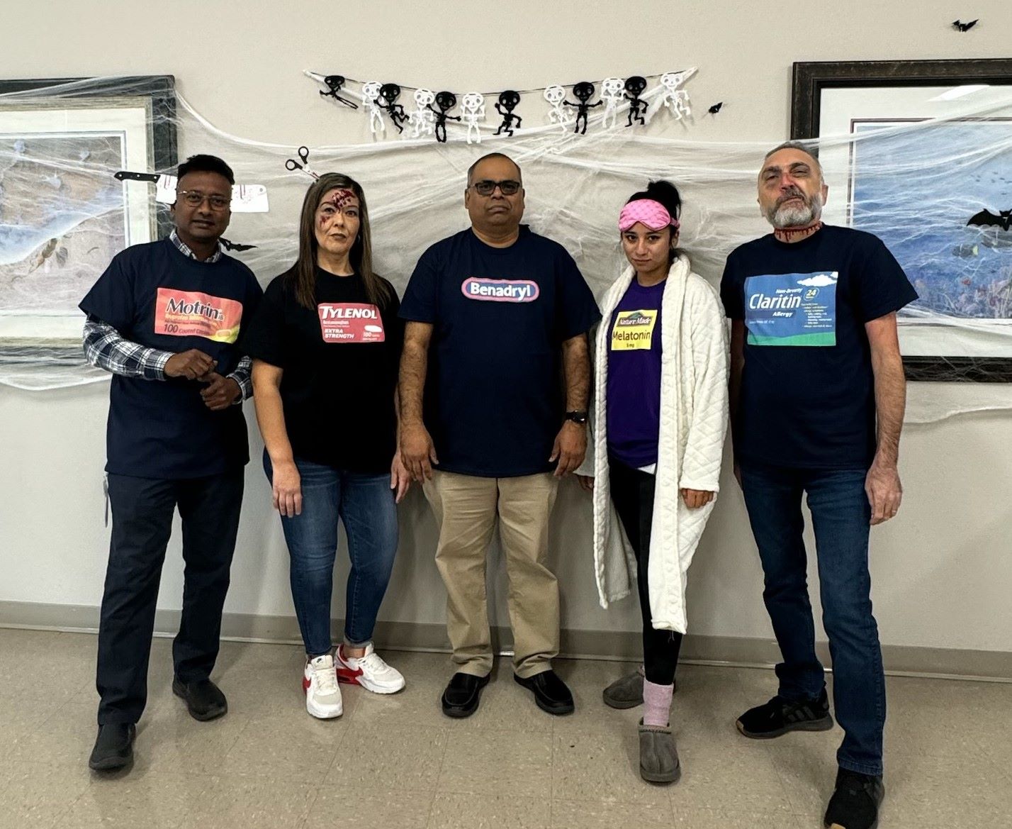 group costume wearing black pharmacy shirts