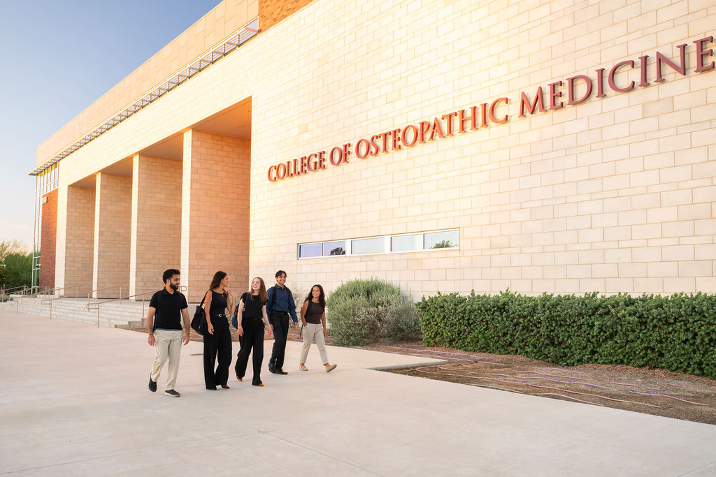 CHSU College of Osteopathic Medicine sign on building with students walking