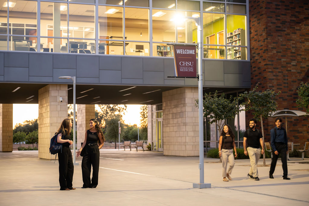 students walking in COM courtyard