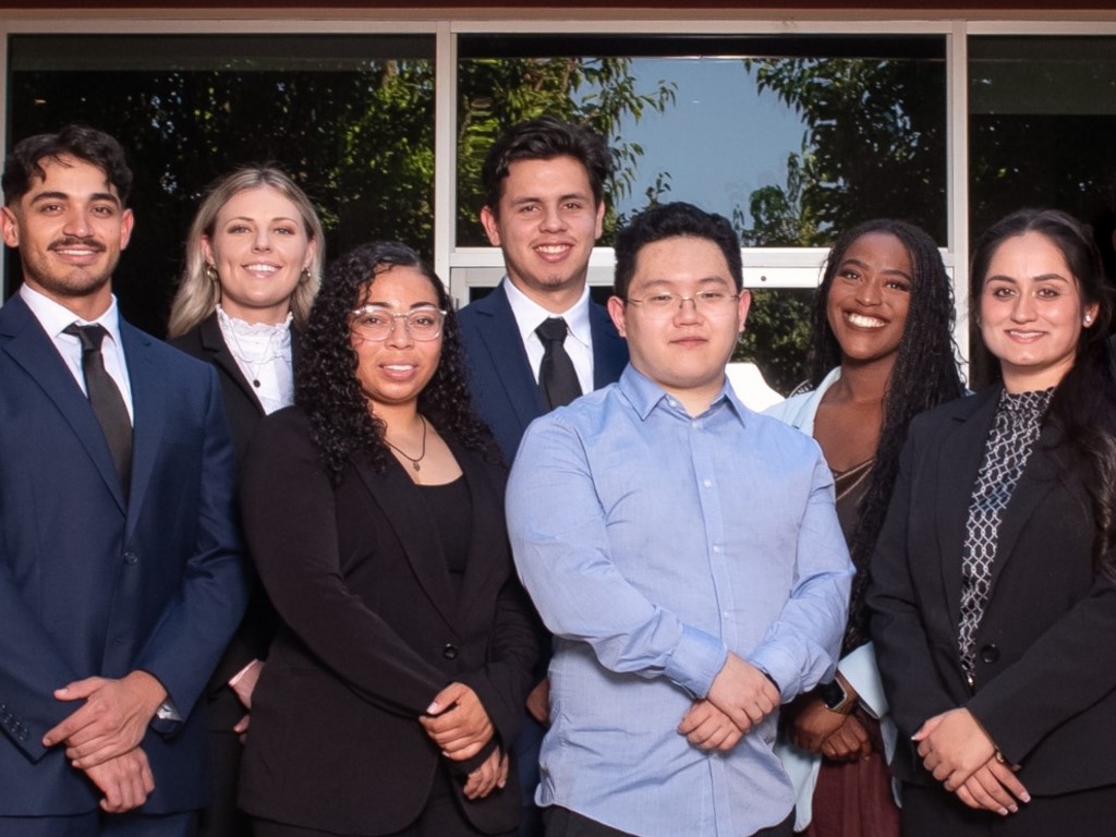 MSBS students in front of glass doors