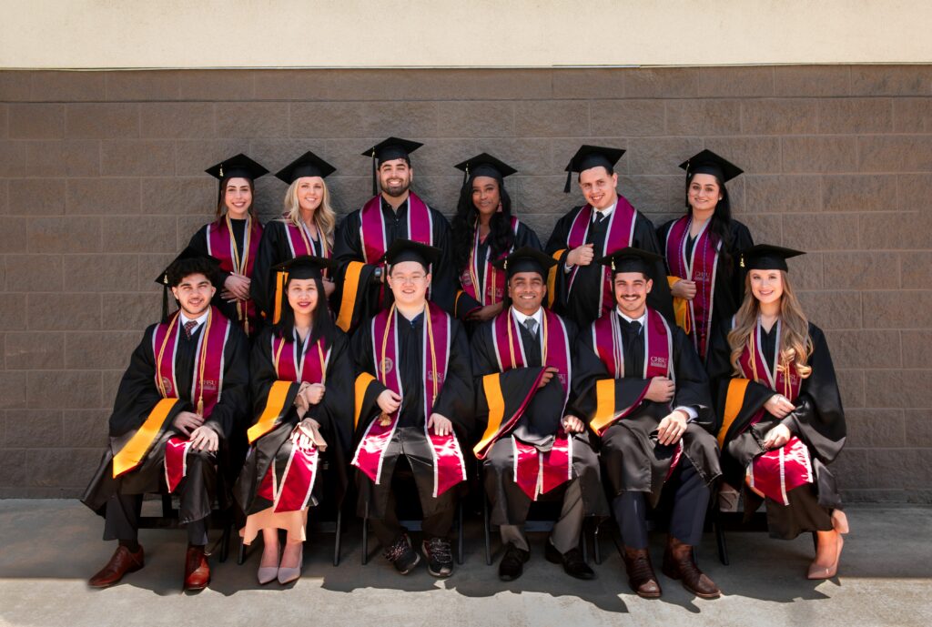 group photo graduates wearing graduate regalia