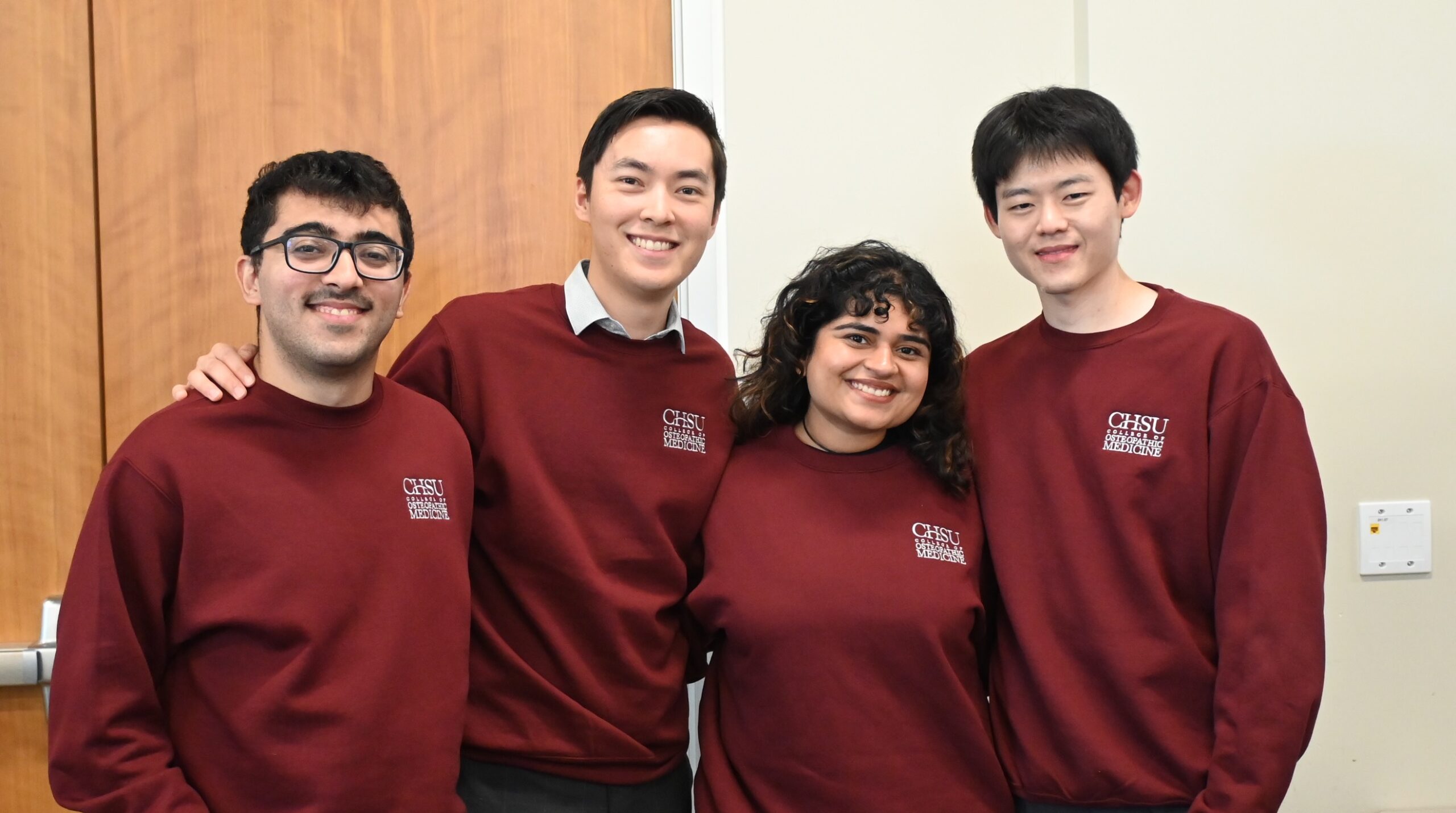 people wearing CHSU branded sweaters