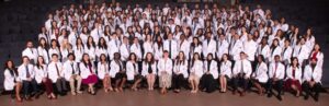 CHSU-COM class of 2029 students in group photo wearing white coats